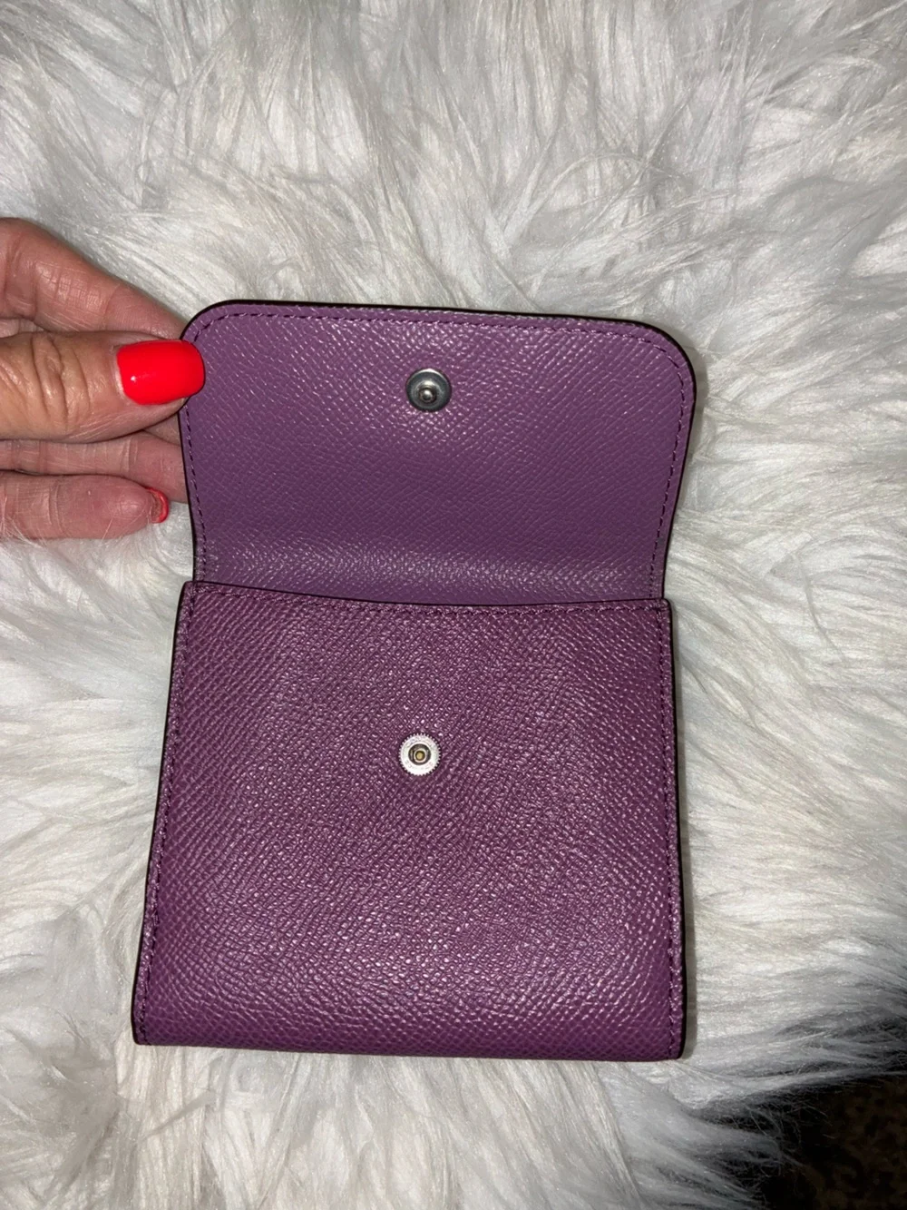 Coach Compact Trifold Pebbled Leather Wallet button closure in Plum/Purple.